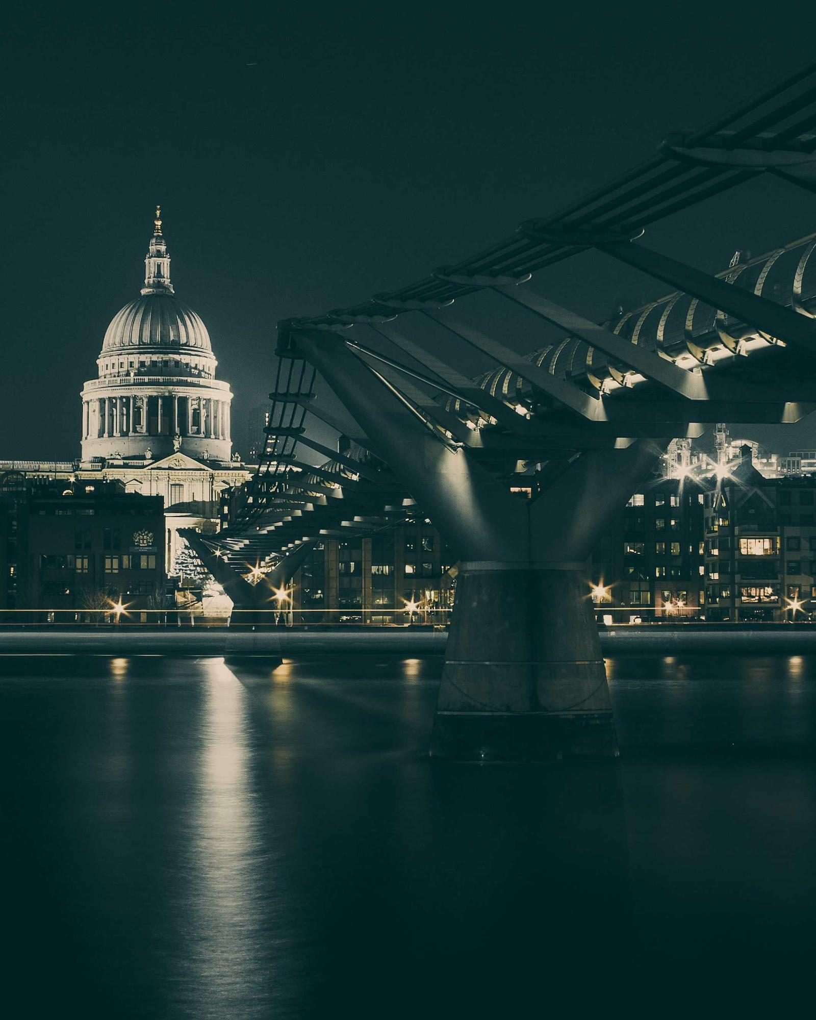 A lit skyline reflected in dark water