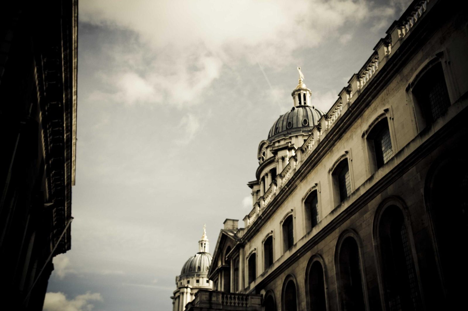 A large building facade in near darkness